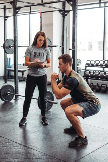 Patient working with a provider at a performance physical therapy clinic in Valparaiso during a functional movement assessment